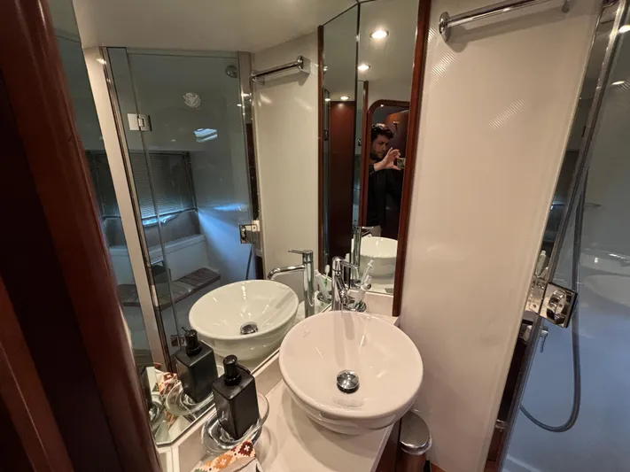  Yacht Photos Pics Luxurious bathroom in 2010 Princess 62 Flybridge yacht with modern fixtures and elegant design.