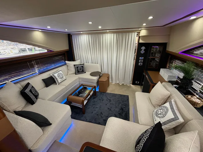  Yacht Photos Pics Luxurious interior of 2010 Princess 62 Flybridge yacht with elegant seating and modern decor.
