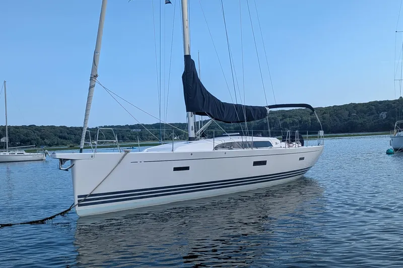  Yacht Photos Pics 2016 X-Yachts XP-44 sailboat anchored on calm water with scenic background.