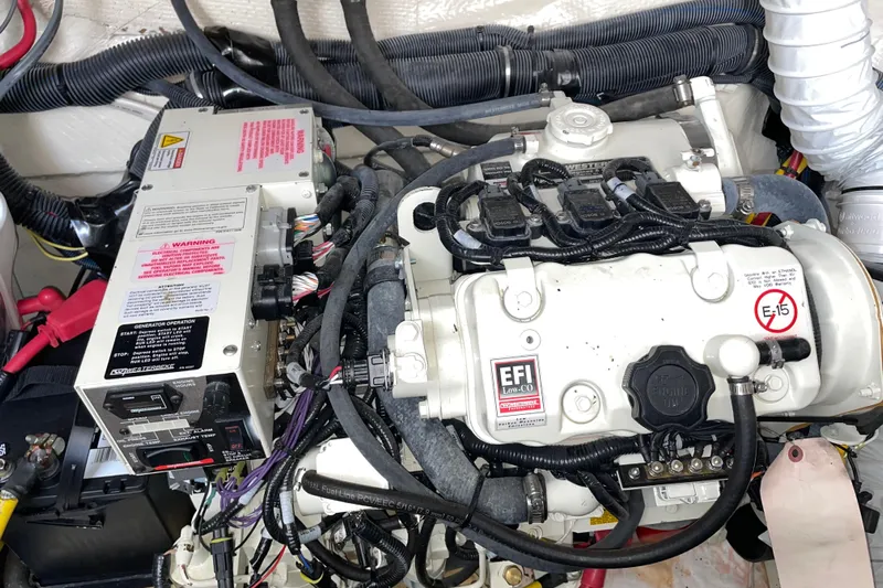  Yacht Photos Pics Engine compartment of a 2019 Rinker 370 EX boat, featuring EFI system and wiring.