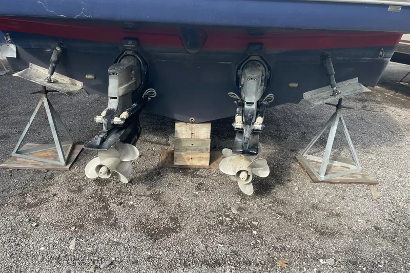  Yacht Photos Pics 2019 Rinker 370 EX boat with dual propellers on stands, rear view.