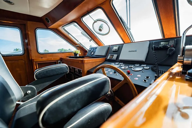 Seaeo Yacht Photos Pics Interior of 1985 Lowland 68 Neth Ships, featuring a classic wooden helm and modern controls.