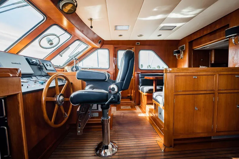 Seaeo Yacht Photos Pics Interior of 1985 Lowland 68 Neth Ships, featuring wooden helm and seating area.