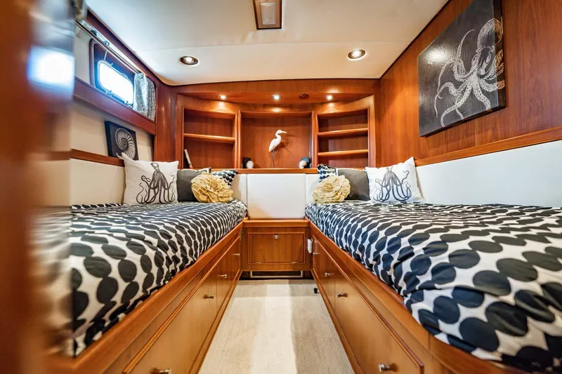 Seaeo Yacht Photos Pics Luxurious 1985 Lowland 68 Neth Ships cabin with twin beds and elegant wood paneling.