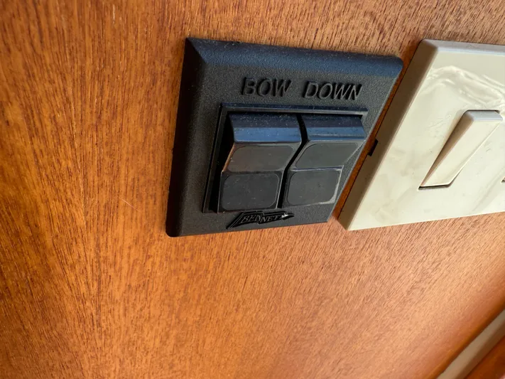 Real Therapy Yacht Photos Pics Control panel on 2001 Mainship 390 Trawler, featuring "Bow Down" buttons on wooden surface.