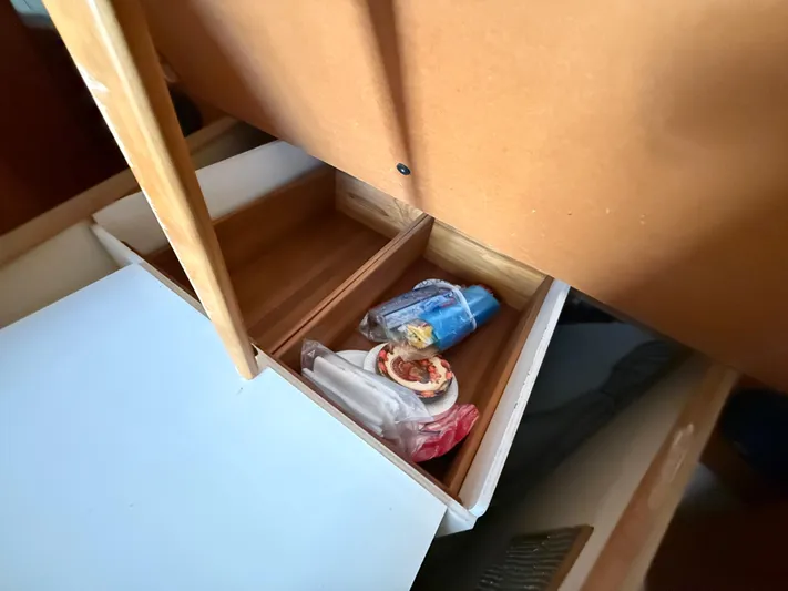 Real Therapy Yacht Photos Pics Open drawer on 2001 Mainship 390 Trawler with miscellaneous items inside.