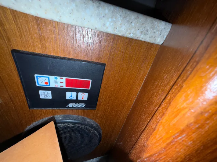 Real Therapy Yacht Photos Pics Control panel on 2001 Mainship 390 Trawler, featuring temperature and fan settings.