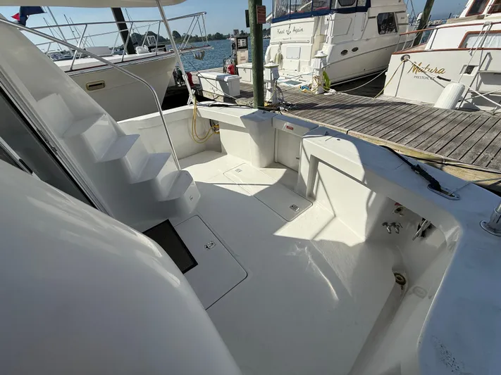 Real Therapy Yacht Photos Pics 2001 Mainship 390 Trawler deck with stairs, docked at marina.