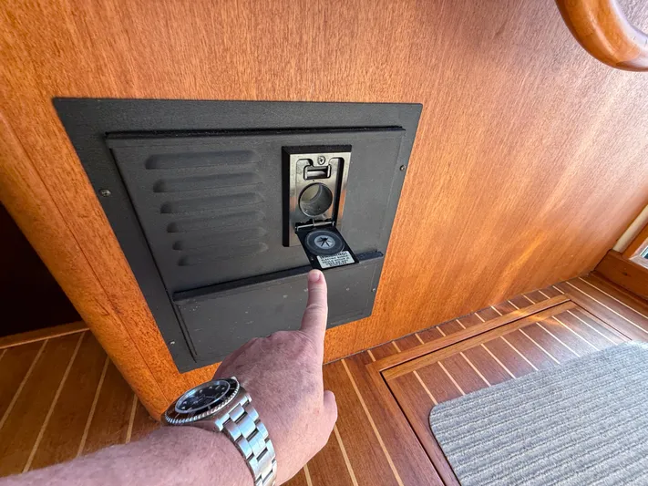 Real Therapy Yacht Photos Pics Finger pointing at a control panel on a 2001 Mainship 390 Trawler boat.