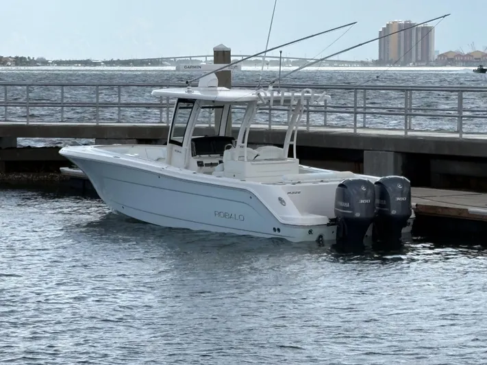  Yacht Photos Pics 2018 Robalo R302 Center Console boat docked by the waterfront.