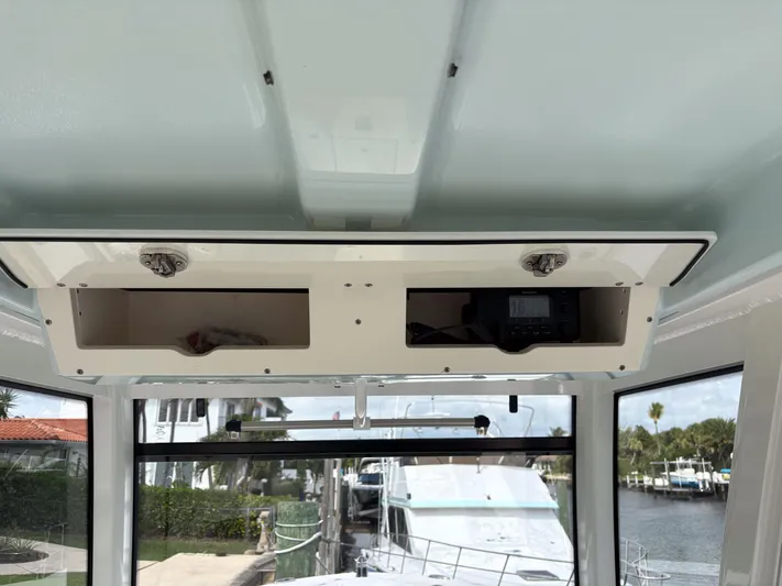  Yacht Photos Pics 2018 Robalo R302 Center Console interior with open storage compartments.