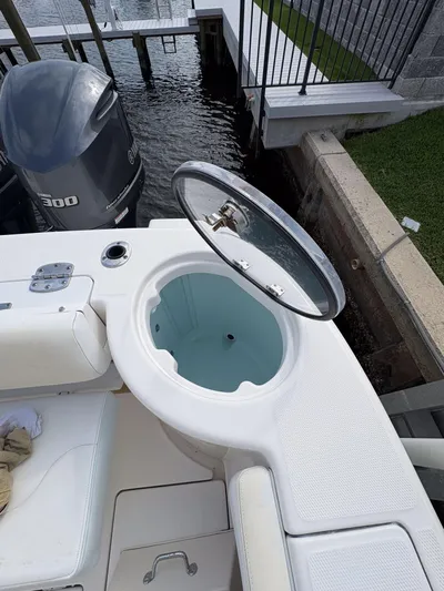  Yacht Photos Pics 2018 Robalo R302 Center Console boat with open livewell and Yamaha outboard engine.