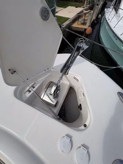  Yacht Photos Pics 2018 Robalo R302 Center Console anchor compartment open at dock.