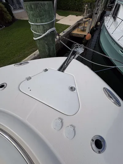  Yacht Photos Pics 2018 Robalo R302 Center Console boat docked, showing bow details and anchor.