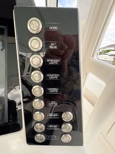  Yacht Photos Pics Control panel of a 2018 Robalo R302 Center Console boat with labeled buttons.