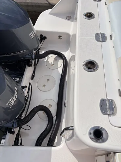  Yacht Photos Pics 2018 Robalo R302 Center Console boat engine area with dual motors and wiring.