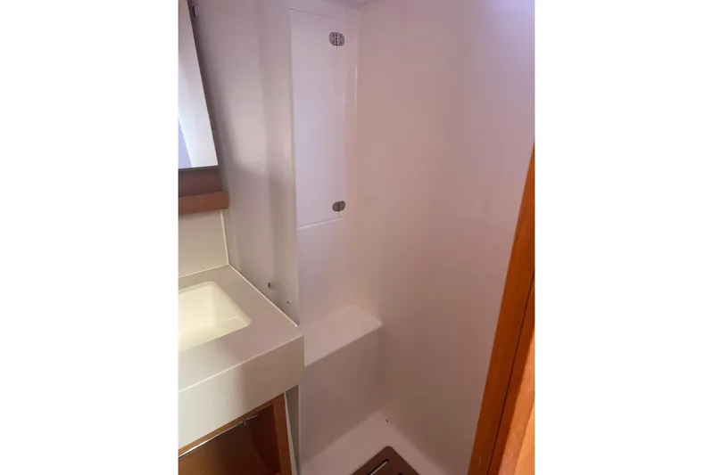  Yacht Photos Pics Bathroom interior of 2022 Dufour 530 yacht, featuring a modern shower and sink.