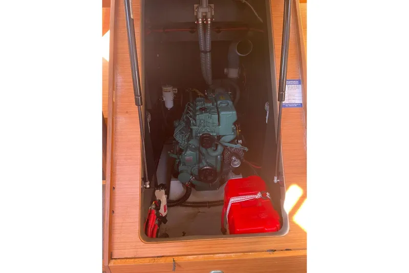  Yacht Photos Pics Engine compartment of 2022 Dufour 530 sailboat, featuring a well-maintained marine engine.