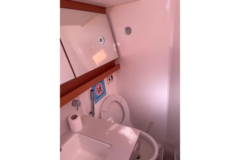  Yacht Photos Pics Bathroom interior of 2022 Dufour 530 yacht, featuring toilet and sink.