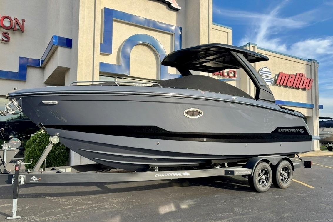 2025 Chaparral 2870 SSX boat on trailer outside dealership.