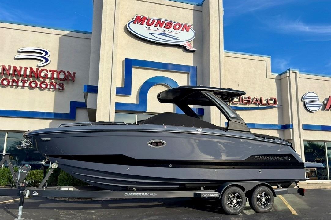 2025 Chaparral 2870 SSX boat on trailer outside Munson Ski & Marine dealership.