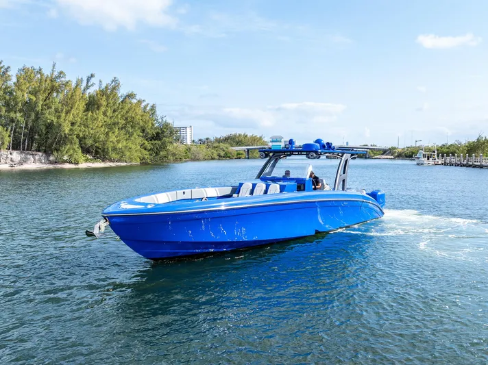  Yacht Photos Pics Blue 2020 Midnight Express Open boat cruising on a scenic waterway.