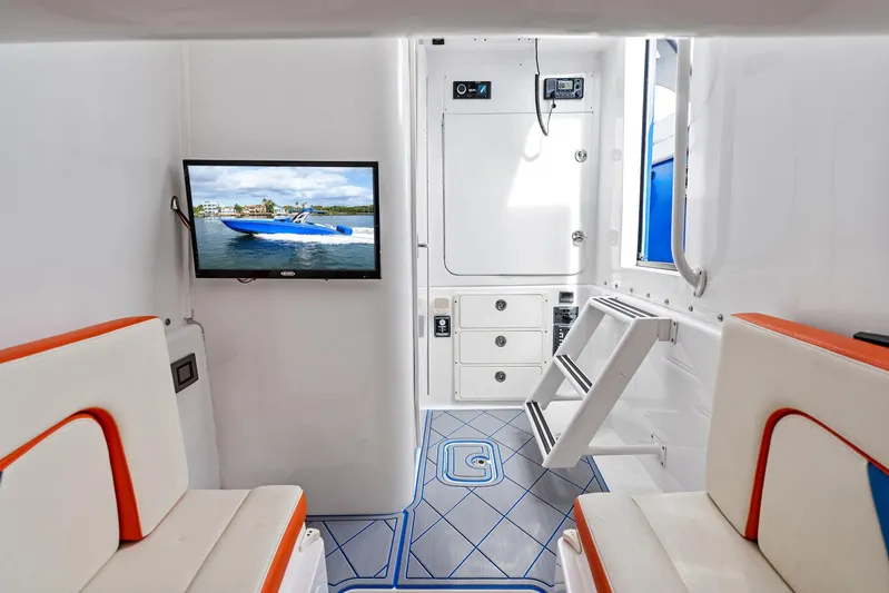  Yacht Photos Pics Interior of 2020 Midnight Express Open boat with seating, TV, and modern design.