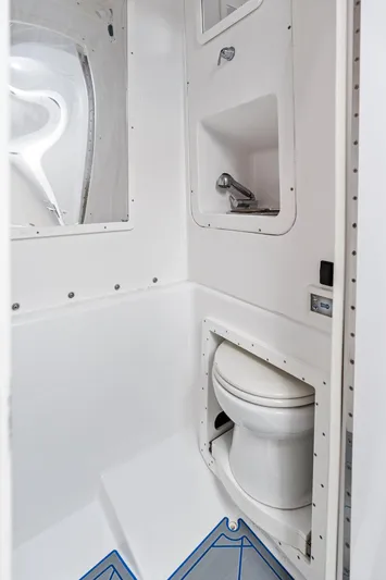  Yacht Photos Pics 2020 Midnight Express Open boat bathroom with toilet and sink, compact and modern design.