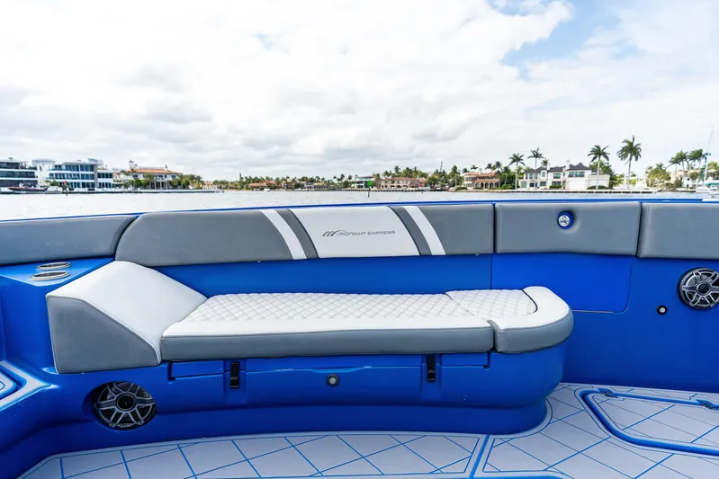  Yacht Photos Pics Luxurious seating on a 2020 Midnight Express Open boat, featuring blue and gray upholstery.