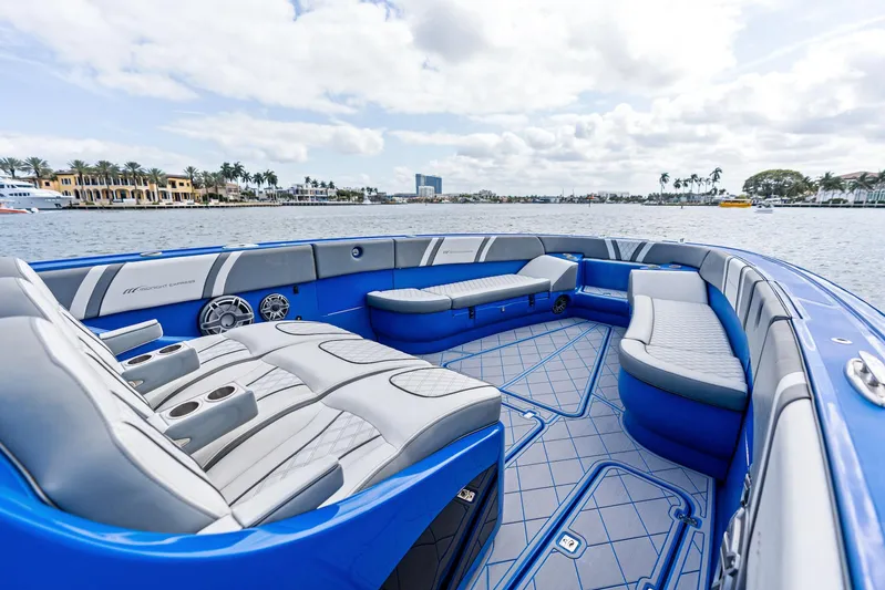  Yacht Photos Pics Luxurious 2020 Midnight Express Open boat interior with blue and gray seating on the water.
