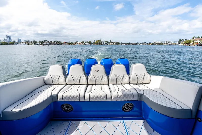  Yacht Photos Pics 2020 Midnight Express Open boat with luxurious seating on a scenic waterway.