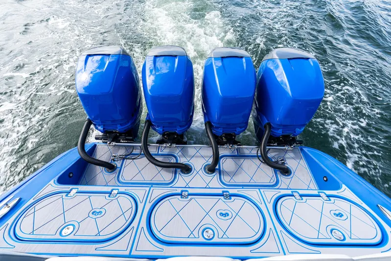  Yacht Photos Pics 2020 Midnight Express Open boat with four blue outboard motors on water.