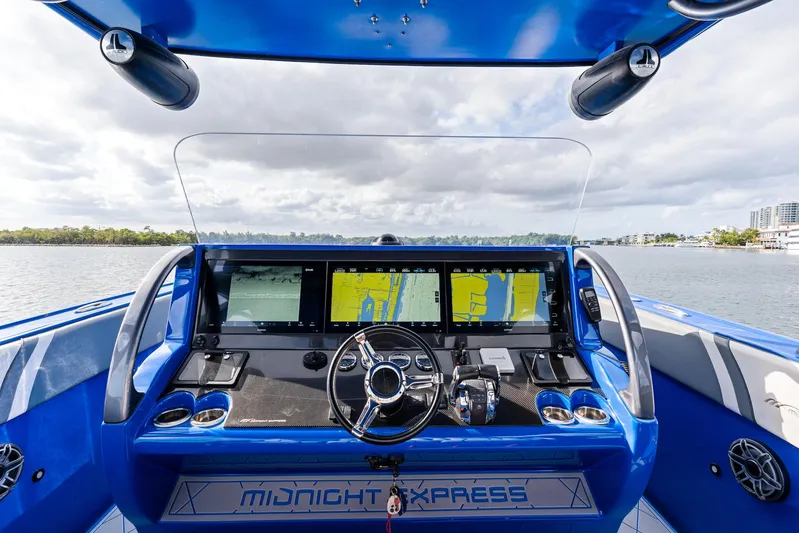  Yacht Photos Pics 2020 Midnight Express Open boat dashboard with advanced navigation screens and controls.