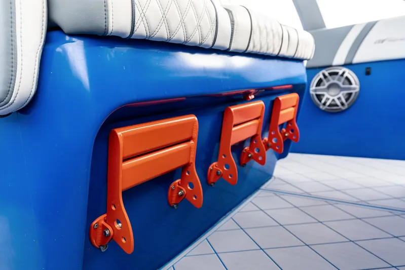 Yacht Photos Pics 2020 Midnight Express Open boat interior with blue and orange accents, featuring seating and speaker.