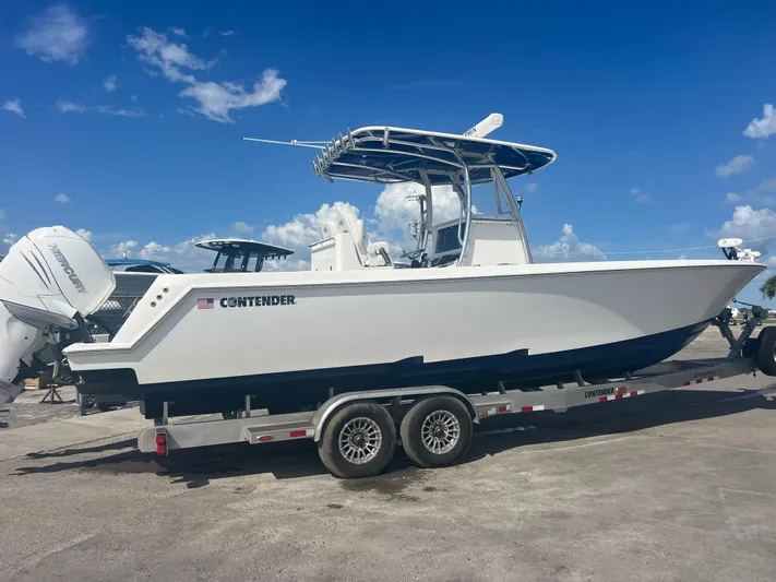  Yacht Photos Pics 2019 Contender 32 ST boat on trailer under clear blue sky.