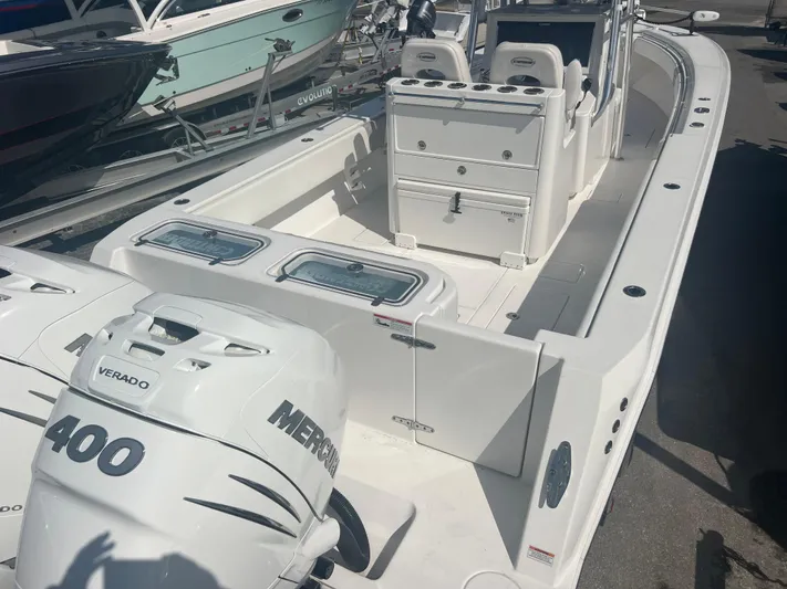  Yacht Photos Pics 2019 Contender 32 ST boat with dual Mercury Verado 400 engines, docked in a marina.