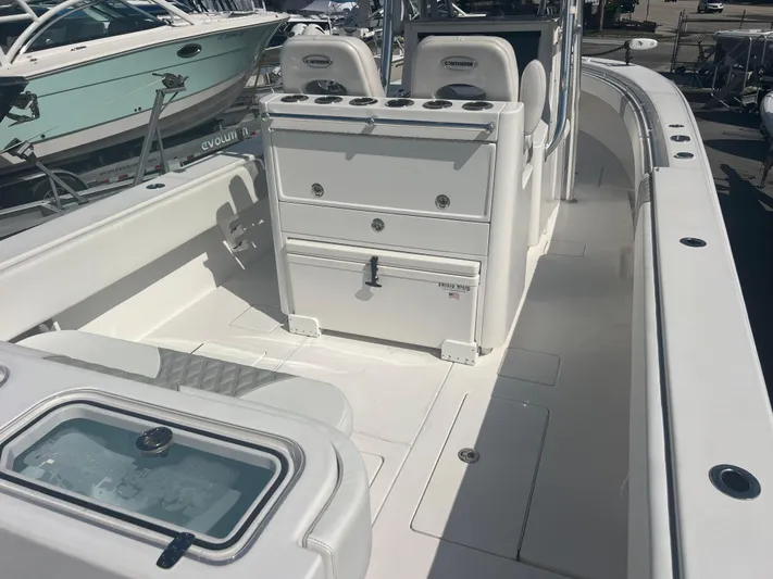  Yacht Photos Pics 2019 Contender 32 ST boat interior with seating and storage compartments.