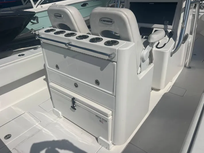  Yacht Photos Pics 2019 Contender 32 ST boat interior with helm and seating area.
