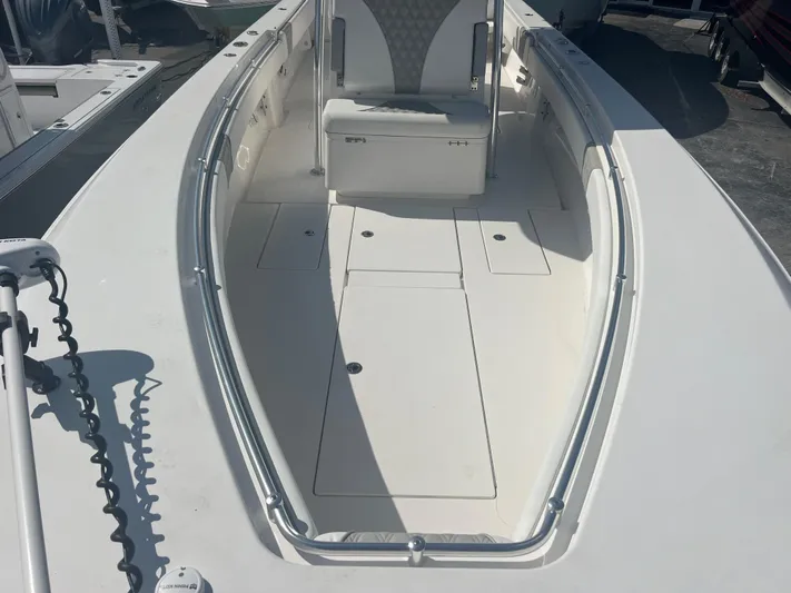  Yacht Photos Pics 2019 Contender 32 ST boat interior with seating and storage compartments.