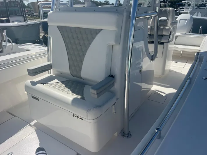  Yacht Photos Pics 2019 Contender 32 ST boat interior with cushioned seating and stainless steel features.
