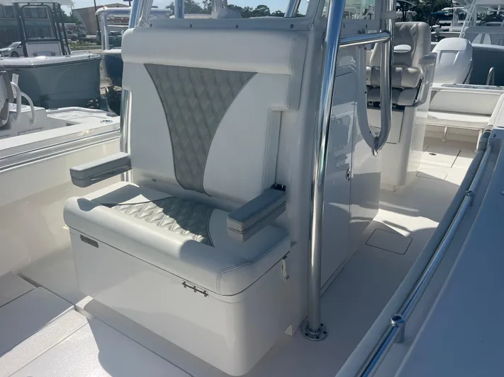  Yacht Photos Pics 2019 Contender 32 ST boat interior with cushioned seating and storage.