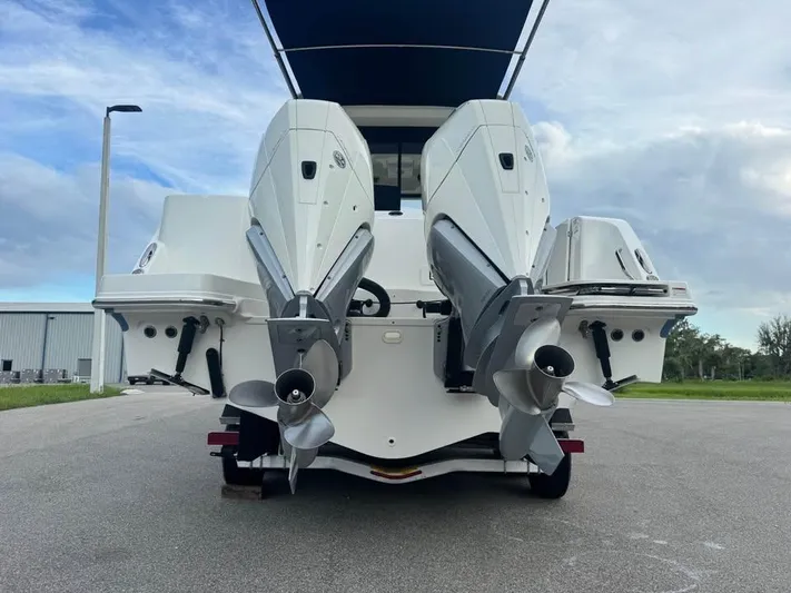  Yacht Photos Pics 2023 Boston Whaler 325 Conquest with dual outboard engines, rear view.