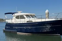 2007 Elling E3 yacht docked on calm water under clear blue sky.