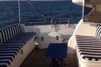 Deck of 2007 Elling E3 yacht with striped seating and ocean view.