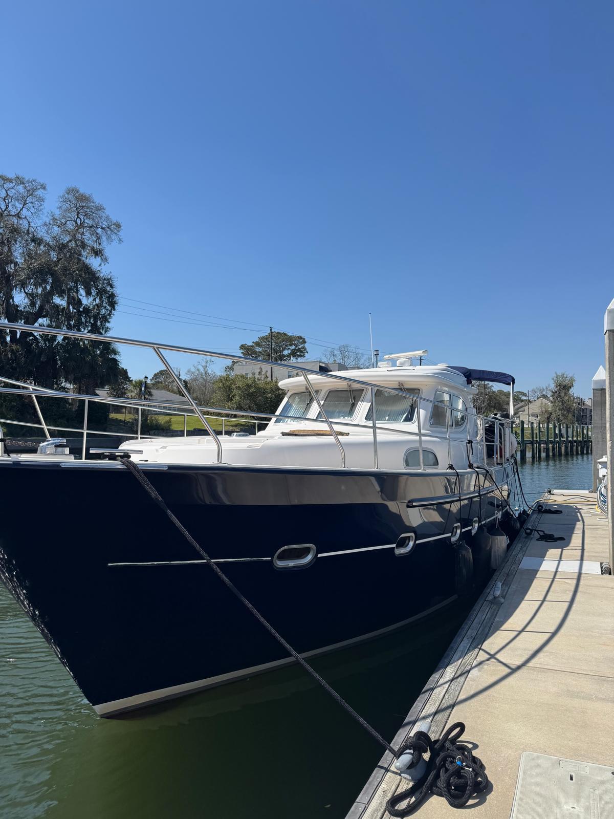 2007 Elling E3 yacht docked at marina under clear blue sky.