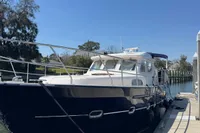2007 Elling E3 yacht docked at marina under clear blue sky.