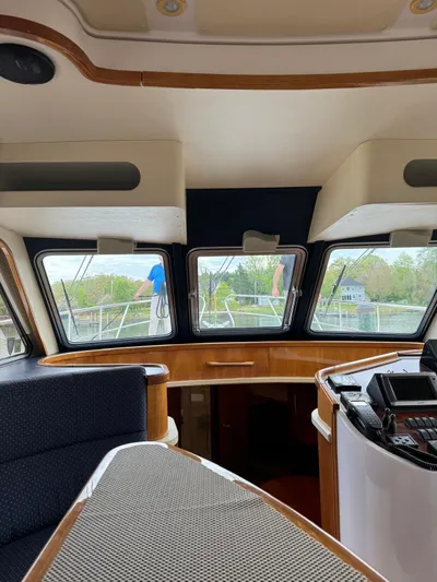 Celaeno Yacht Photos Pics Interior view of 2007 Elling E3 yacht with modern dashboard and panoramic windows.