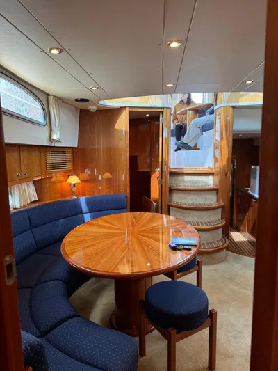 Celaeno Yacht Photos Pics Luxurious interior of 2007 Elling E3 yacht with elegant wood finishes and cozy seating area.