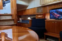 Luxurious interior of a 2007 Elling E3 yacht with polished wood and modern amenities.