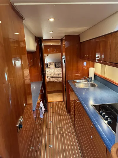 Celaeno Yacht Photos Pics Luxurious 2007 Elling E3 yacht interior with sleek wood finishes and modern kitchen amenities.